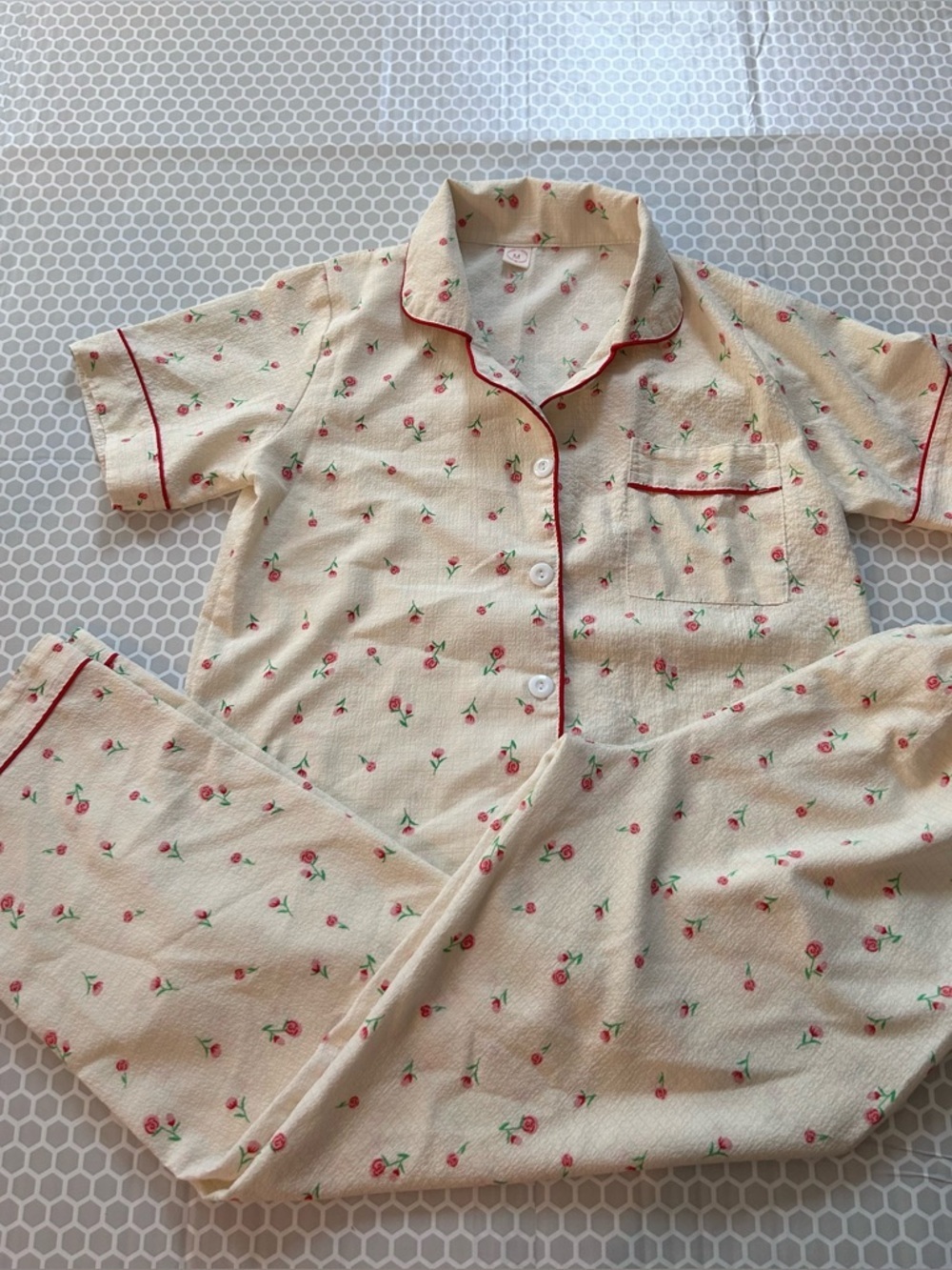 Cream Floral Kids Pajama Set with Red Trim and Button-Front Top. Size M